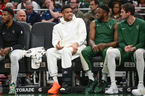 Milwaukee Bucks forward Giannis Antetokounmpo (34) sits on the bench with a calf injury