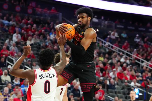 Southern California Trojans guard Bro<em></em>nny James (6) pulling down a defensive rebound from Arizona Wildcats guard Jaden Bradley (0) during a basketball game at the T-Mobile Arena in Las Vegas.