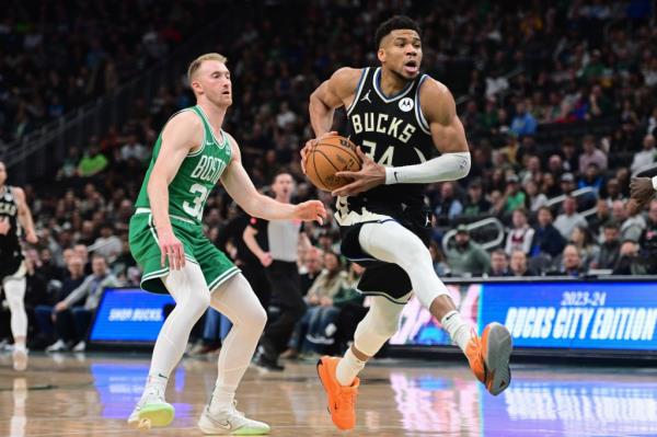 Milwaukee Bucks forward Giannis Antetokounmpo (34) drives for the basket against Boston Celtics forward Sam Hauser (30) in the second quarter at Fiserv Forum. 