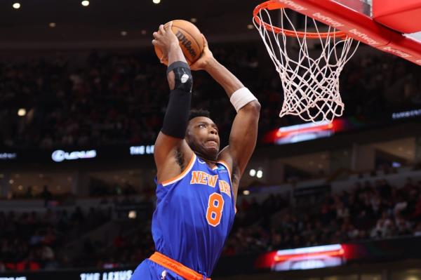 OG Anunoby, who scored 24 points, slams home a dunk during the first half of the Knicks' win.