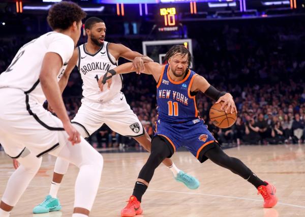 Mikal Bridges #1 of the Brooklyn Nets defends against Jalen Brunson #11 of the New York Knicks