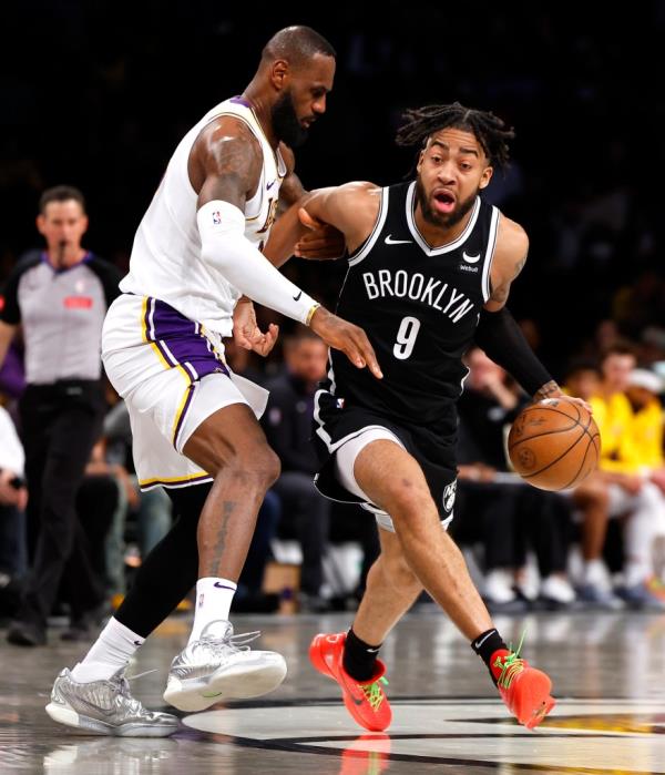 Nets forward Trendon Watfor<em></em>d (9) drives to the basket against Los Angeles Lakers forward LeBron James