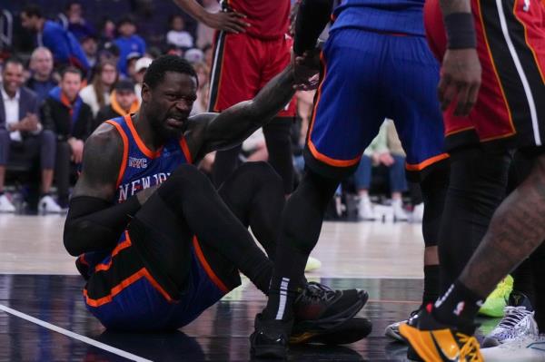 Julius Randle #30 of the New York Knicks reacts after an injury against the Miami Heat in the second half at Madison Square Garden on January 27, 2024