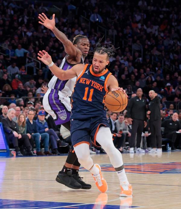 New York Knicks guard Jalen Brunson #11 drives pass Sacramento Kings guard Keon Ellis #23 during the third quarter.