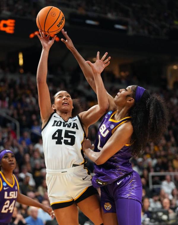 Iowa Hawkeyes forward Hannah Stuelke (45) shoots the ball as LSU Lady Tigers forward Angel Reese (10) defends during the Elite 8 round of the NCAA Women's Basketball Tournament between Iowa and LSU at MVP Arena, Monday, April 1, 2024 in Albany, N.Y.
