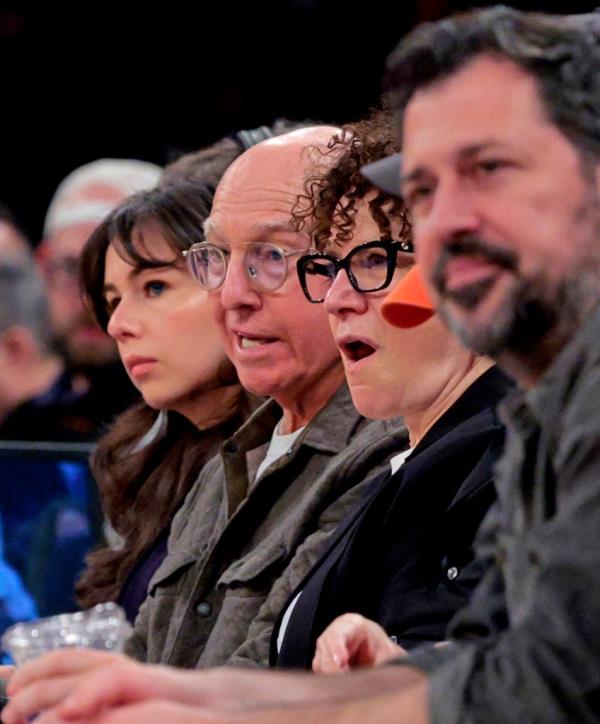 Comedians Larry David and Susie Essman sit on celebrity row during the second quarter.
