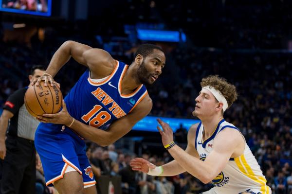 Golden State Warriors guard Brandin Podziemski (2) guards New York Knicks guard Alec Burks (18) during the first half at Chase Center. 