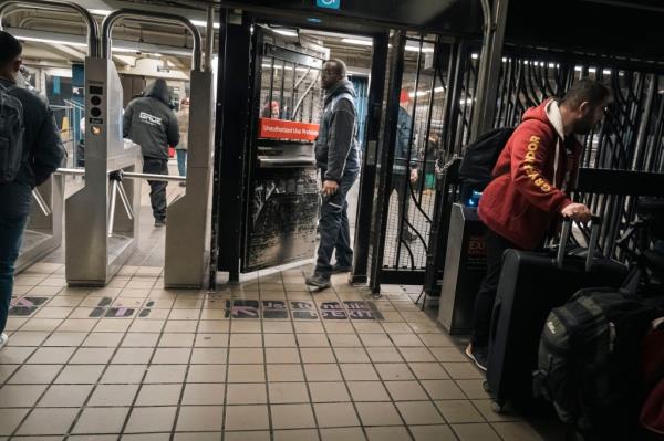 A man walks through the emergency gate at Times Square