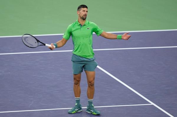 Novak Djokovic reacts during his loss to Luca Nardi.