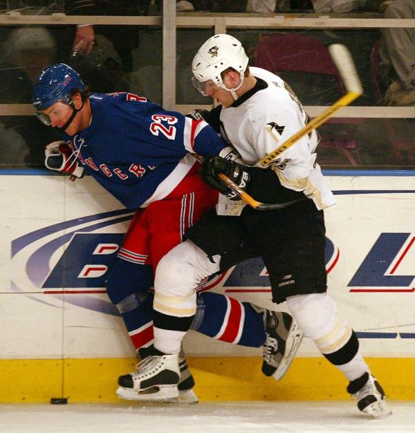 Ko<em></em>nstantin Koltsov (r.) checks the Rangers' Karel Rachunek during a game at MSG on March 23, 2004.