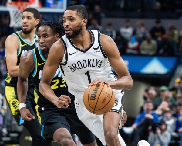 Mikal Bridges, who had just seven points, drives on Aaron Nesmith during the Nets' 121-100 loss to the Pacers.