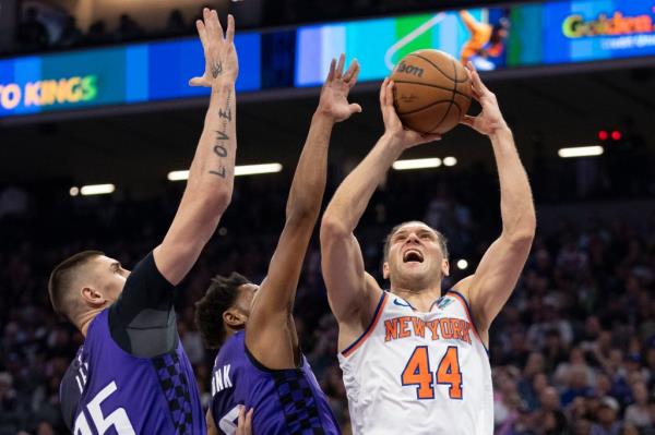 Bojan Bogdanovic, who had nine points off the bench, puts up a shot as Alex Len (far left) and Malik Monk defend during the Knicks' victory.