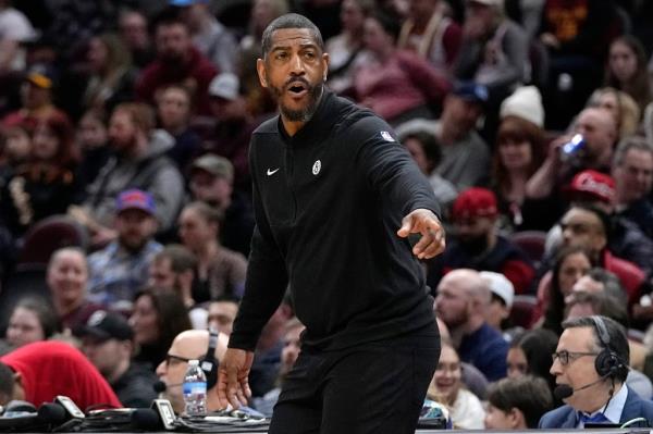 Nets interim head coach Kevin Ollie gestures in the second half of an NBA basketball game against the Cleveland Cavaliers.