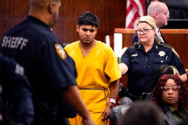 Johan Jose Martinez-Rangel, one of the two men accused of killing 12-year-old Jocelyn Nungaray, is led from the courtroom by deputies on Tuesday, June 25, 2024 in Houston. 