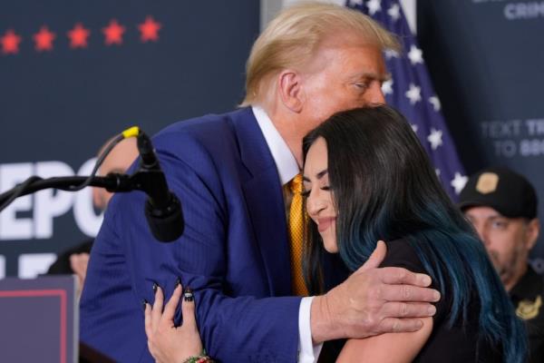 Republican presidential nominee former President Do<em></em>nald Trump, left, hugs Alexis Nungaray, mother of the late Jocelyn Nungaray, during a news co<em></em>nference at Austin-Bergstrom Internatio<em></em>nal Airport, Friday, Oct. 25, 2024, in Austin, Texas.