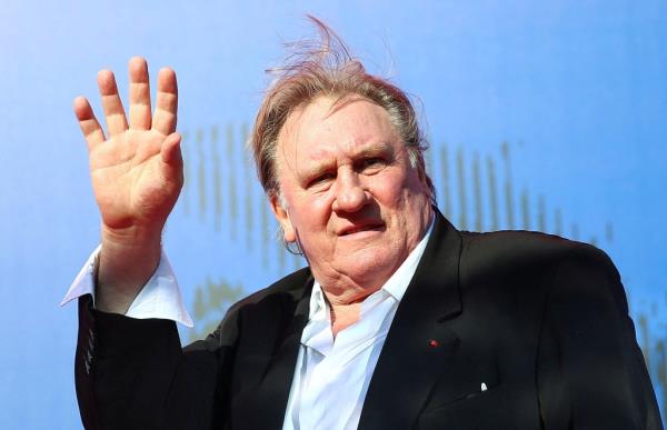 Depardieu waves as he arrives during a red carpet event for the movie "Novecento- Atto Primo" at the 74th Venice Film Festival in Venice, Italy, Italy September 5, 2017.   