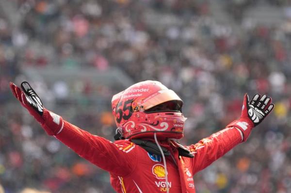 Ferrari driver Carlos Sainz of Spain celebrates